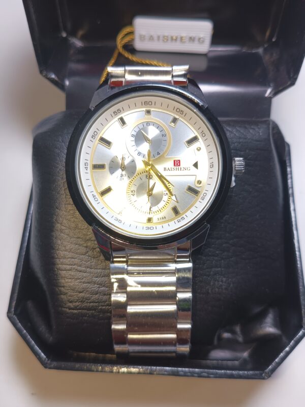 A silver and black watch in a box, perfect for adding a touch of elegance to any outfit.