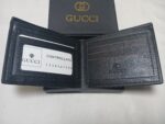 Gucci black wallet with 3 stripes: red stripe between two green stripes.